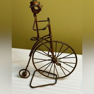 Vintage Rock Creek Metal Craft Man Riding Big Bike